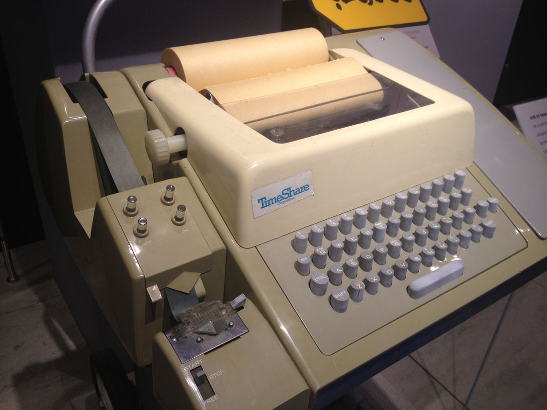 Figure 3 — A Teletype Model 33 ASR at the Computer History Museum — the beige ASCII machine, 110 baud, with its 8-level paper-tape punch and reader at the lower left: the machine that became the first compute…